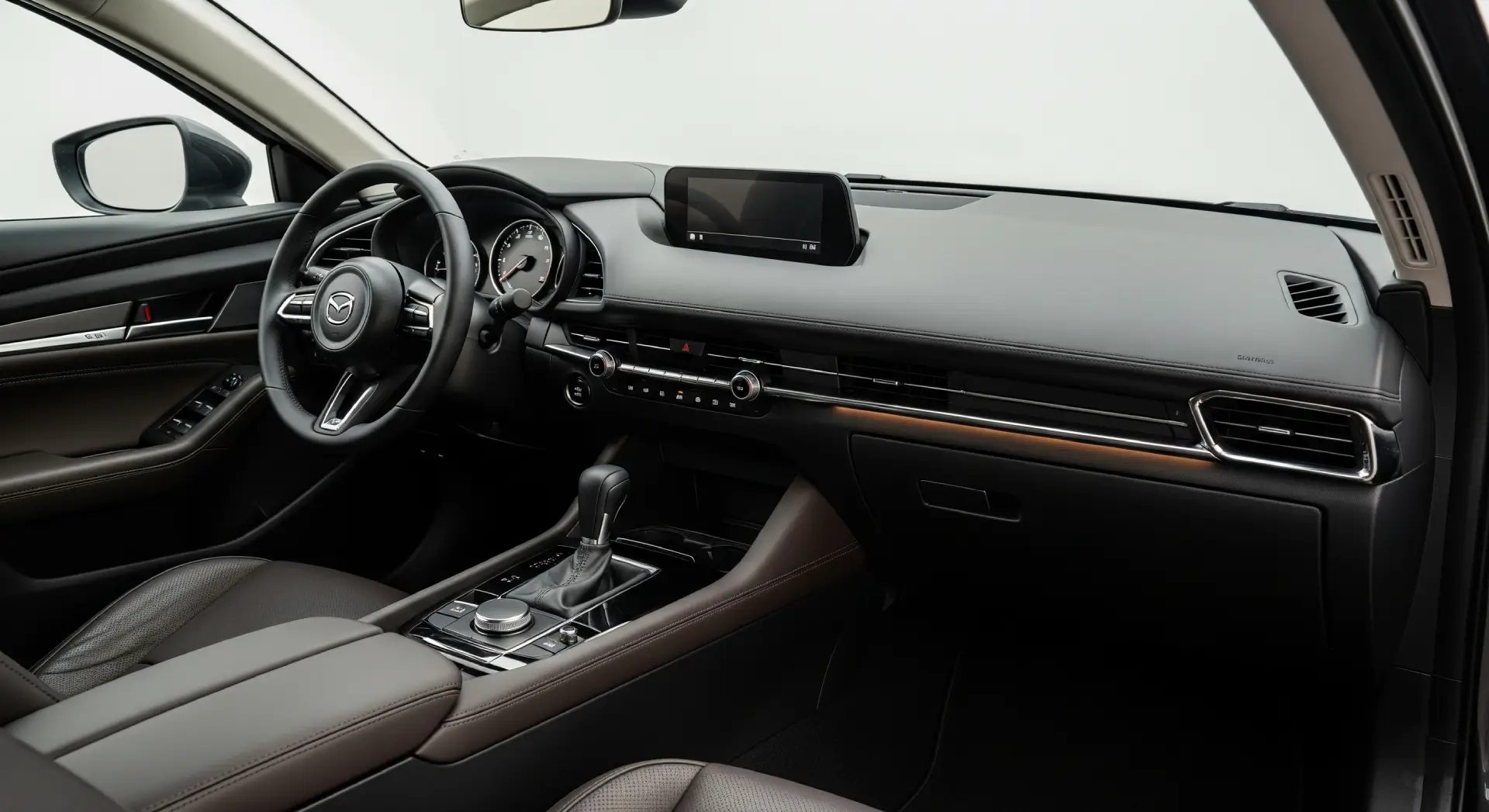 Inside, the Mazda 3 offers a clean, driver-focused cabin with high-quality materials.