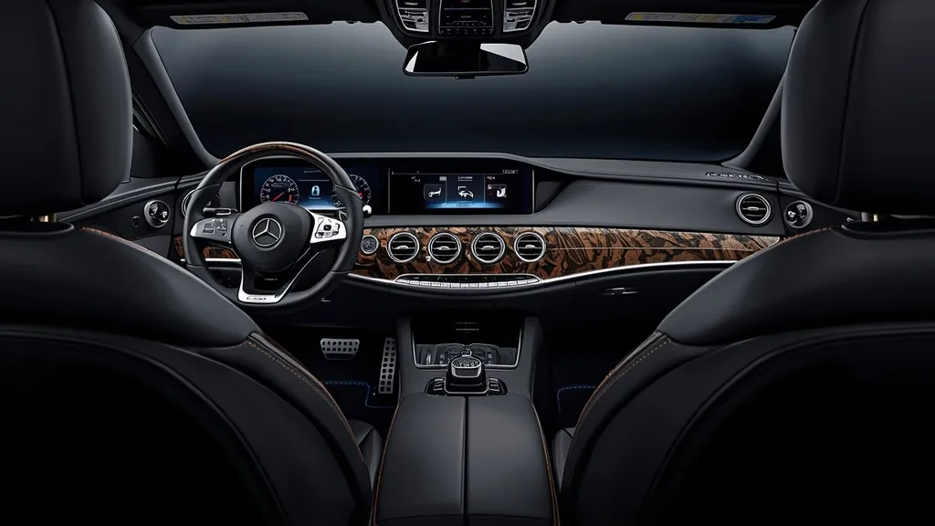 Interior cabin of a Mercedes S63 AMG W221, showing luxurious Nappa leather and advanced infotainment.
