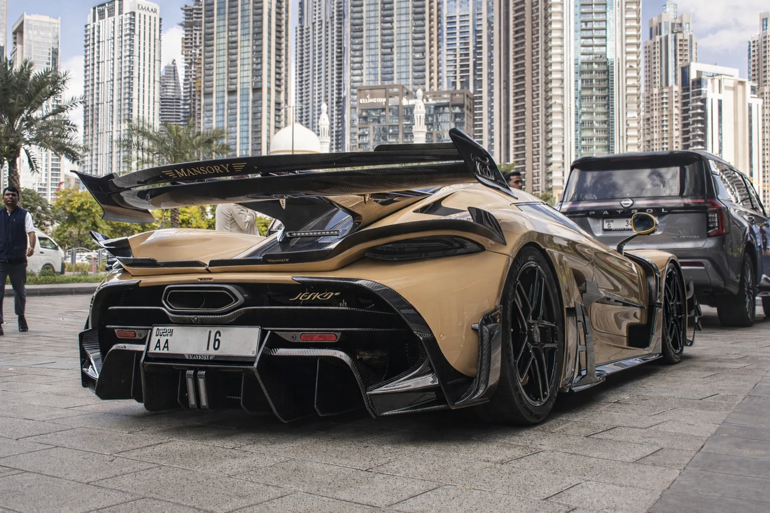Koenigsegg Jesko Attack, Mansory upgrade, hypercar customization, luxury supercar, carbon fiber aerodynamics, high performance car, E85 biofuel, automotive tuning 11