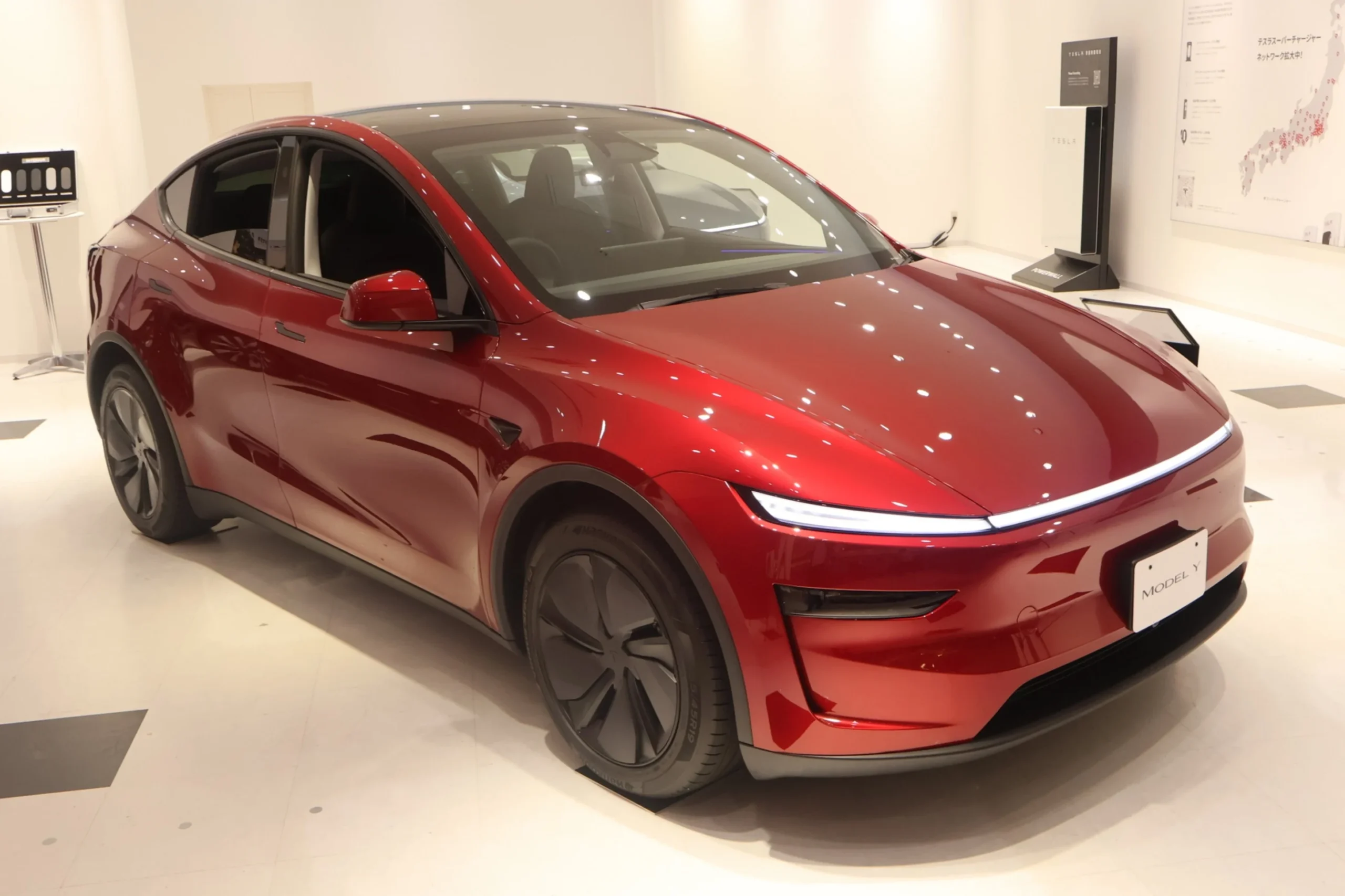 Tesla Japan, electric vehicle sales Japan, Tesla showroom expansion, Tesla charging network, EV market strategy, Tesla Japan growth, electric cars Japan 2