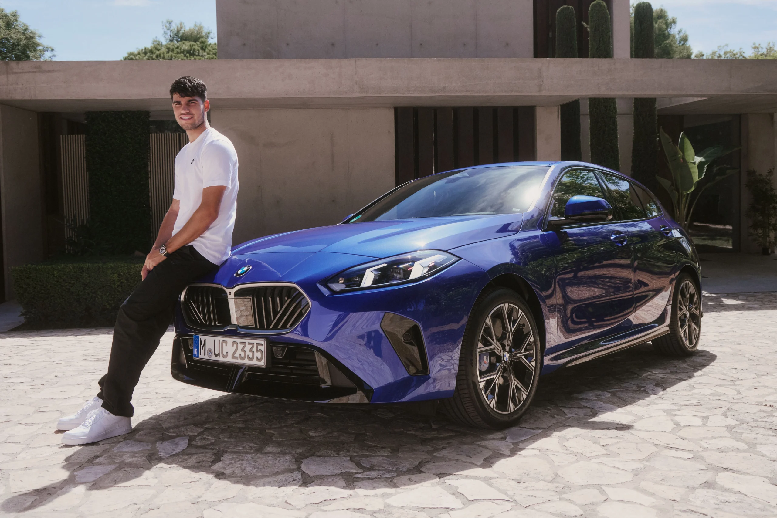 Carlos Alcaraz, BMW 1 Series, tennis star lifestyle, luxury car choices, Rolex Daytona, Australian Open champion, modest celebrity cars 4