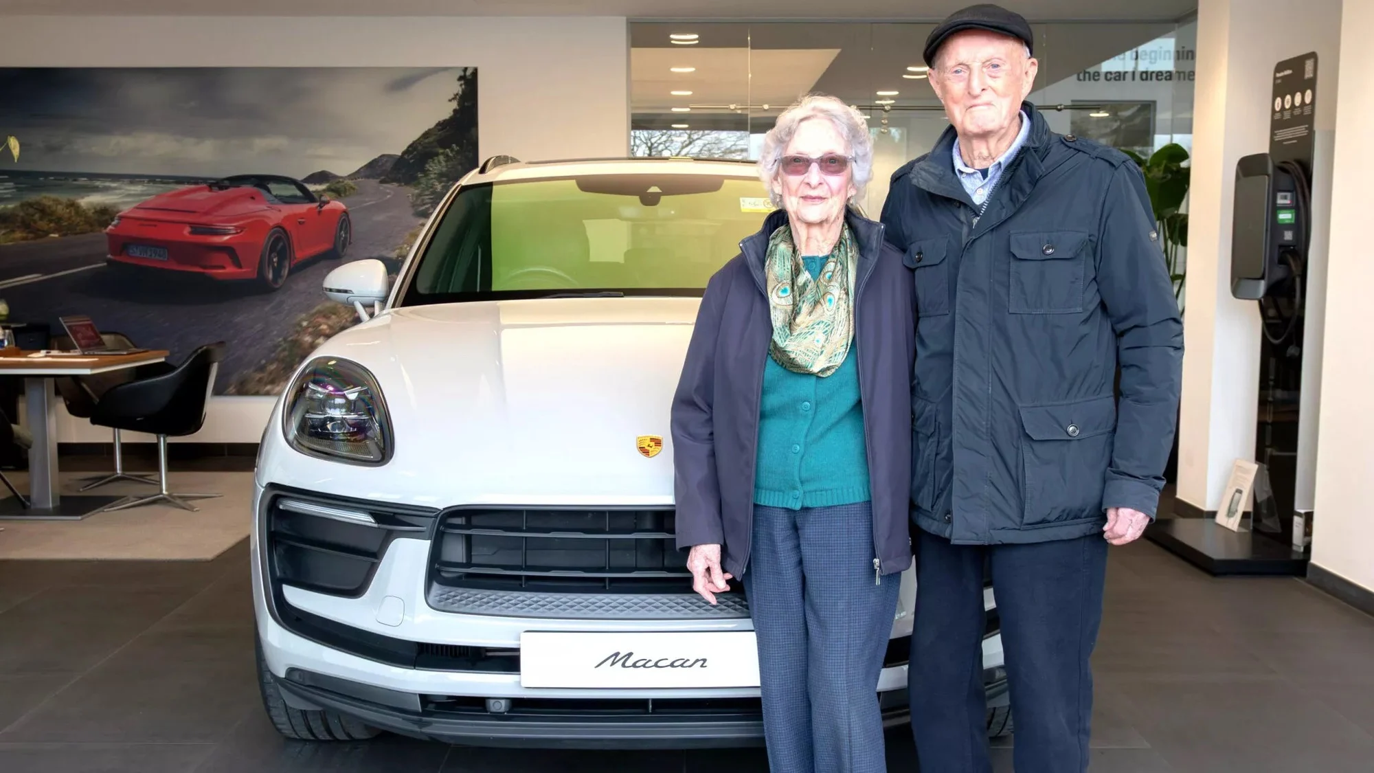 Porsche Macan, senior drivers, 70th wedding anniversary, luxury SUV, late-life adventure, couple milestone, Porsche celebration, elderly car enthusiasts 2