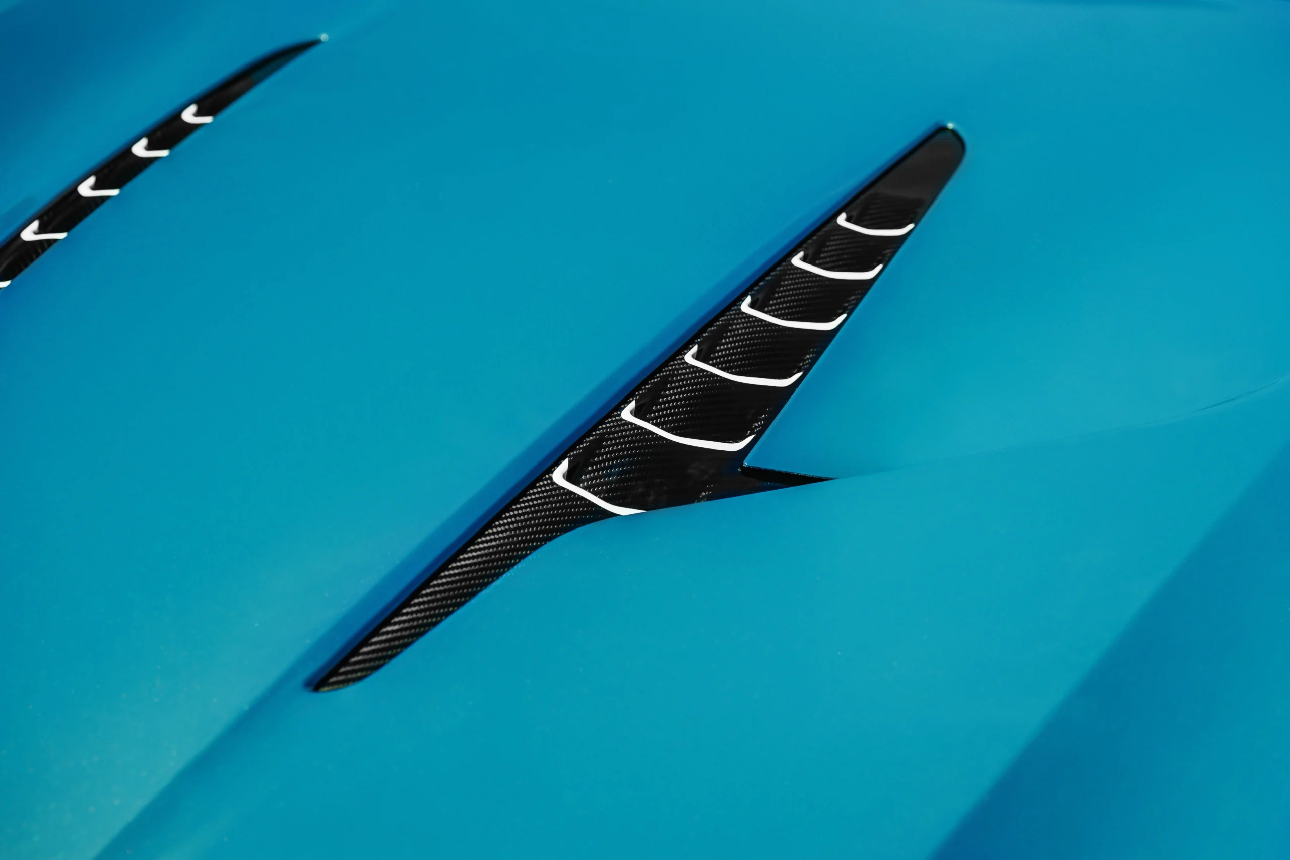 Aston Martin Vanquish Volante Wave Edition, luxury supercar auction, Naples Winter Wine Festival, limited edition Aston Martin, V12 supercar price, exclusive car experiences, charity car auction 3