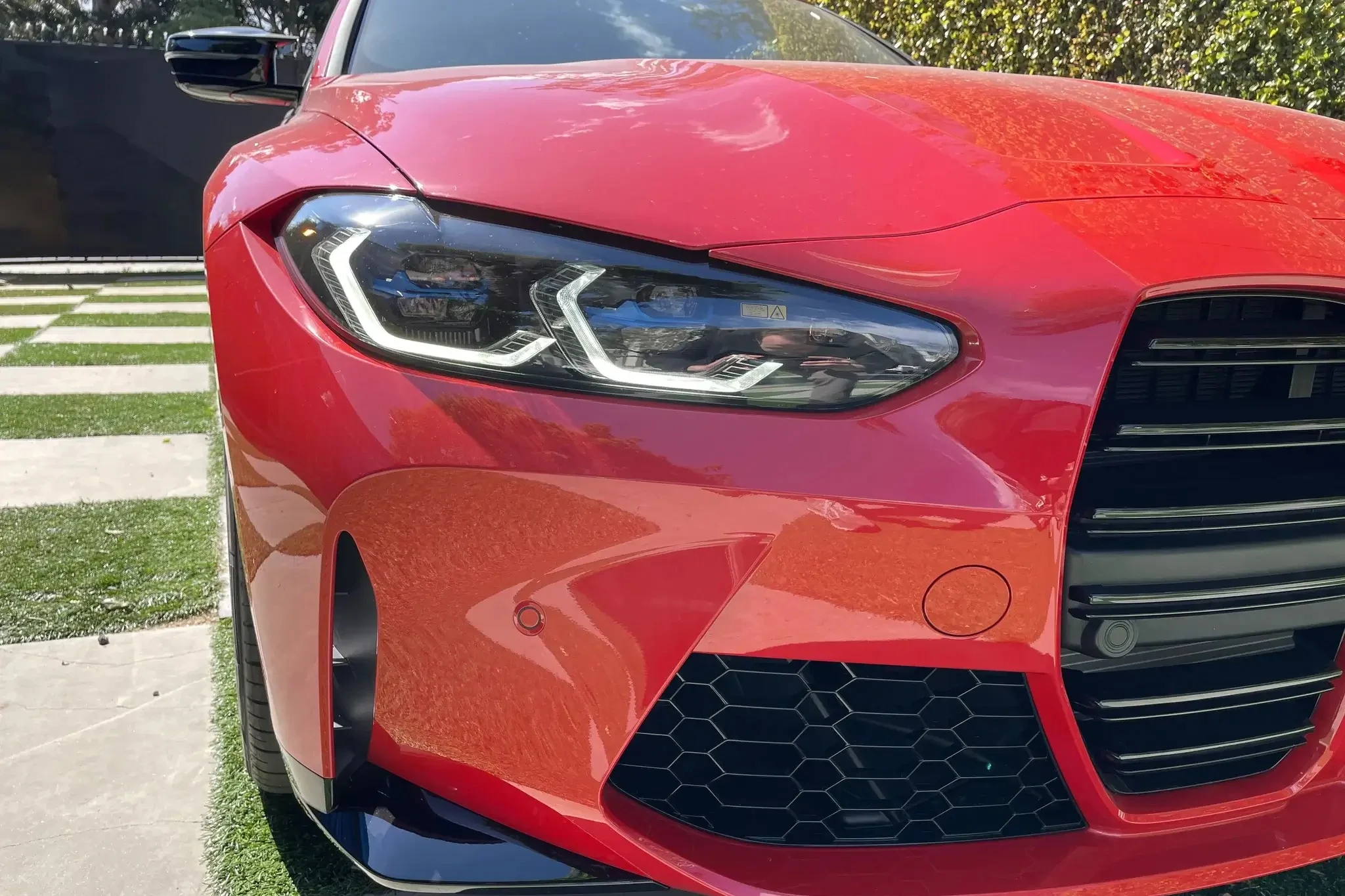 BMW laser headlights, BMW M4 Competition, headlight replacement cost, luxury car maintenance, automotive repair, BMW repair cost, laser headlight repair, car insurance claims 4