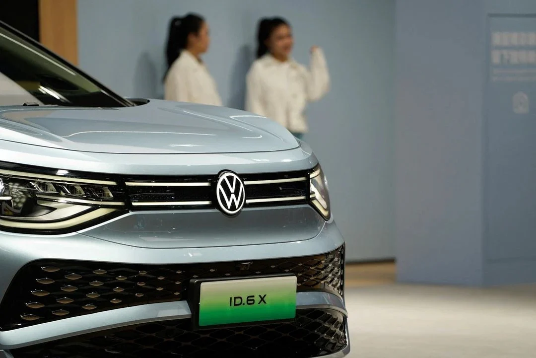Volkswagen profit decline, Volkswagen layoffs, automotive industry challenges, US tariffs, China market competition, Porsche internal combustion strategy, operating margin 3