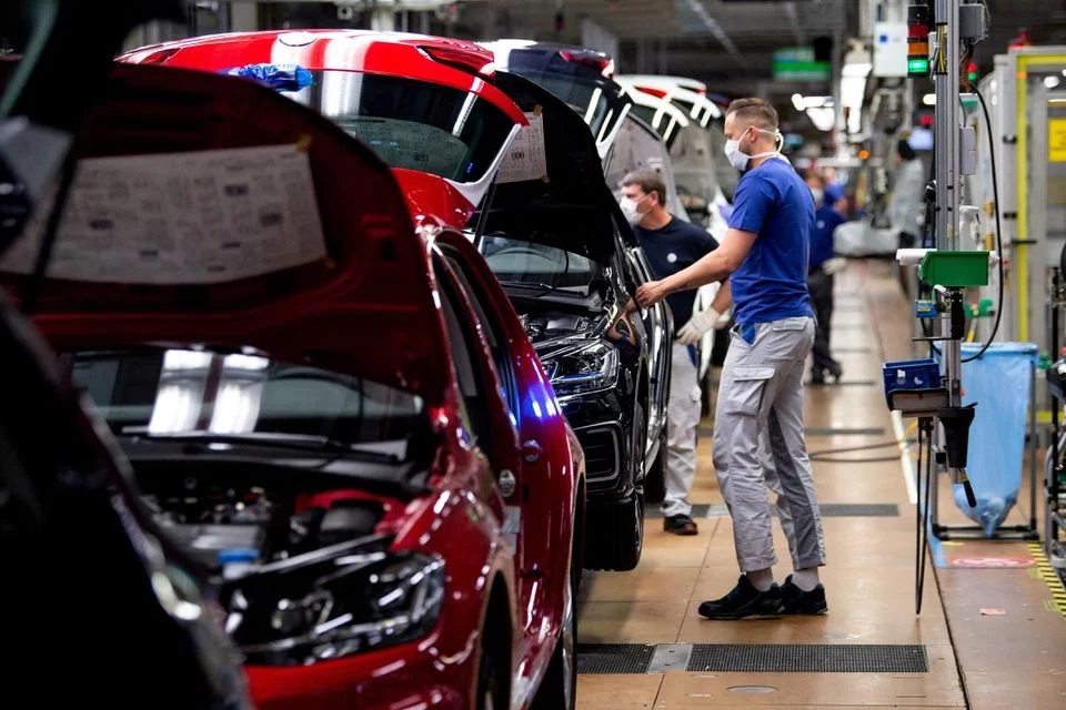 Volkswagen profit decline, Volkswagen layoffs, automotive industry challenges, US tariffs, China market competition, Porsche internal combustion strategy, operating margin 2