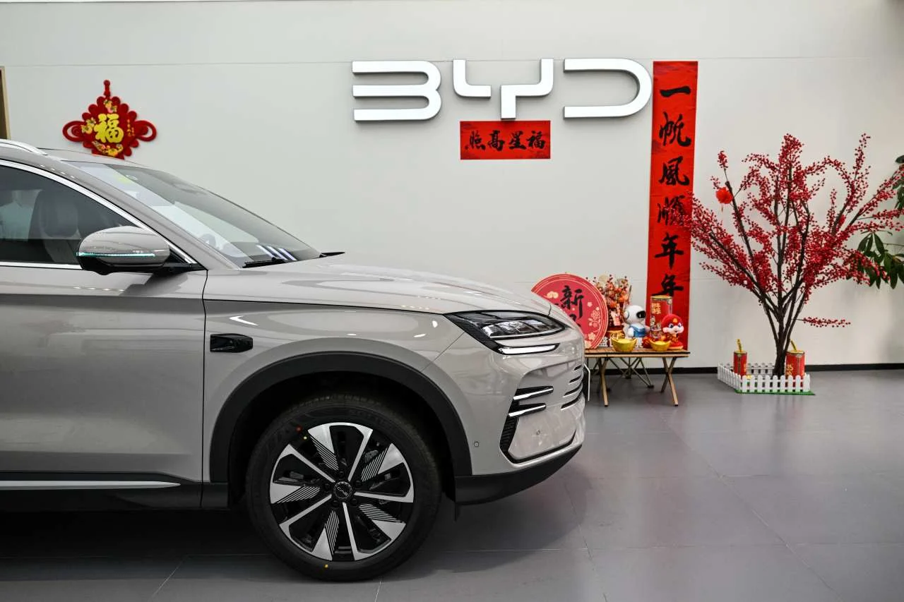 BYD profit decline, electric vehicle market, China EV competition, BYD earnings 2025, EV pricing war, global EV expansion 3