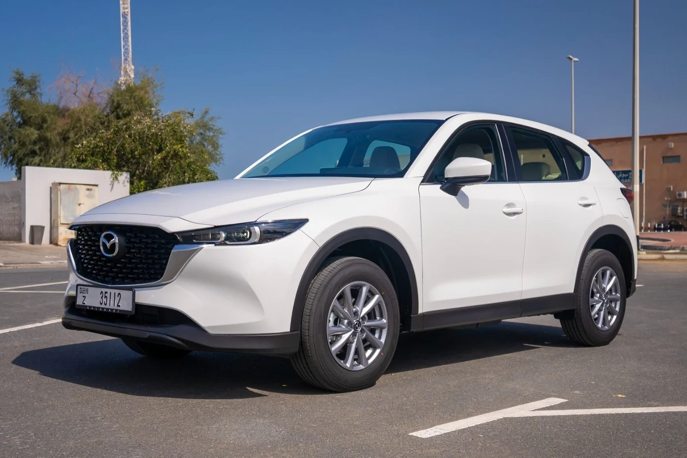 Japanese automakers, Middle East car exports, Toyota Land Cruiser, Mazda CX-5, automotive supply chain, geopolitical tensions, car production cuts 3