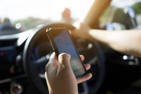 distracted driving, TikTok while driving, road safety US, NHTSA statistics, smartphone distraction, teen driving risks, infotainment system safety 2