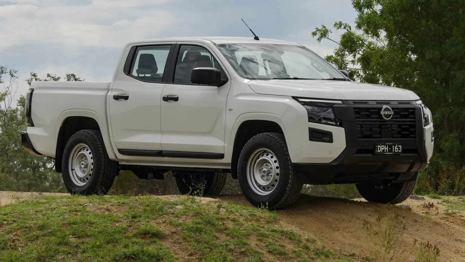 Nissan Navara, custom suspension, stock shocks removed, Australia pickup, Premcar, Mitsubishi Triton, off‑road performance, sustainable automotive 3