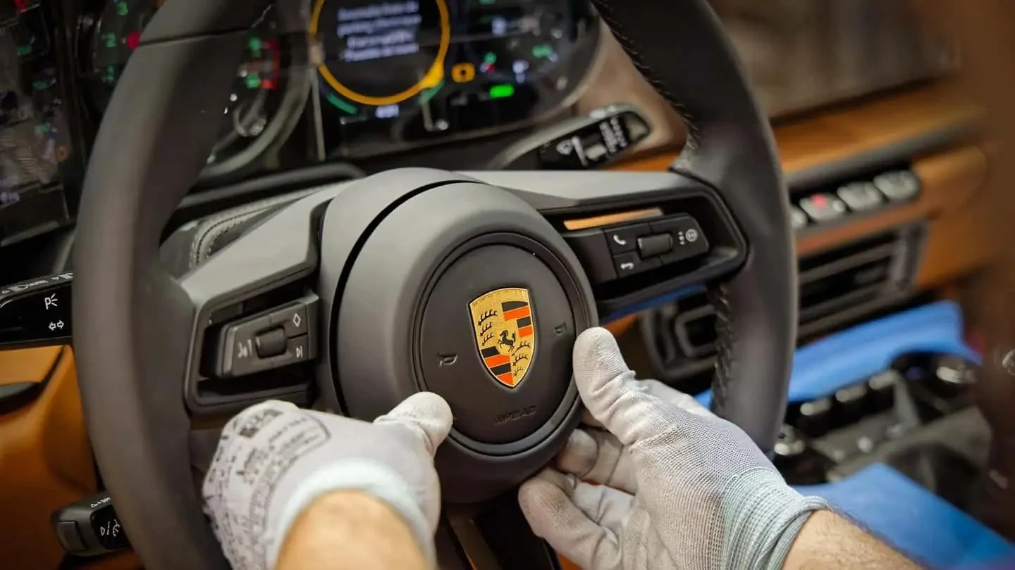 Porsche layoffs, Porsche business strategy, luxury car market, Porsche restructuring, sports car industry, automotive profit margins 2