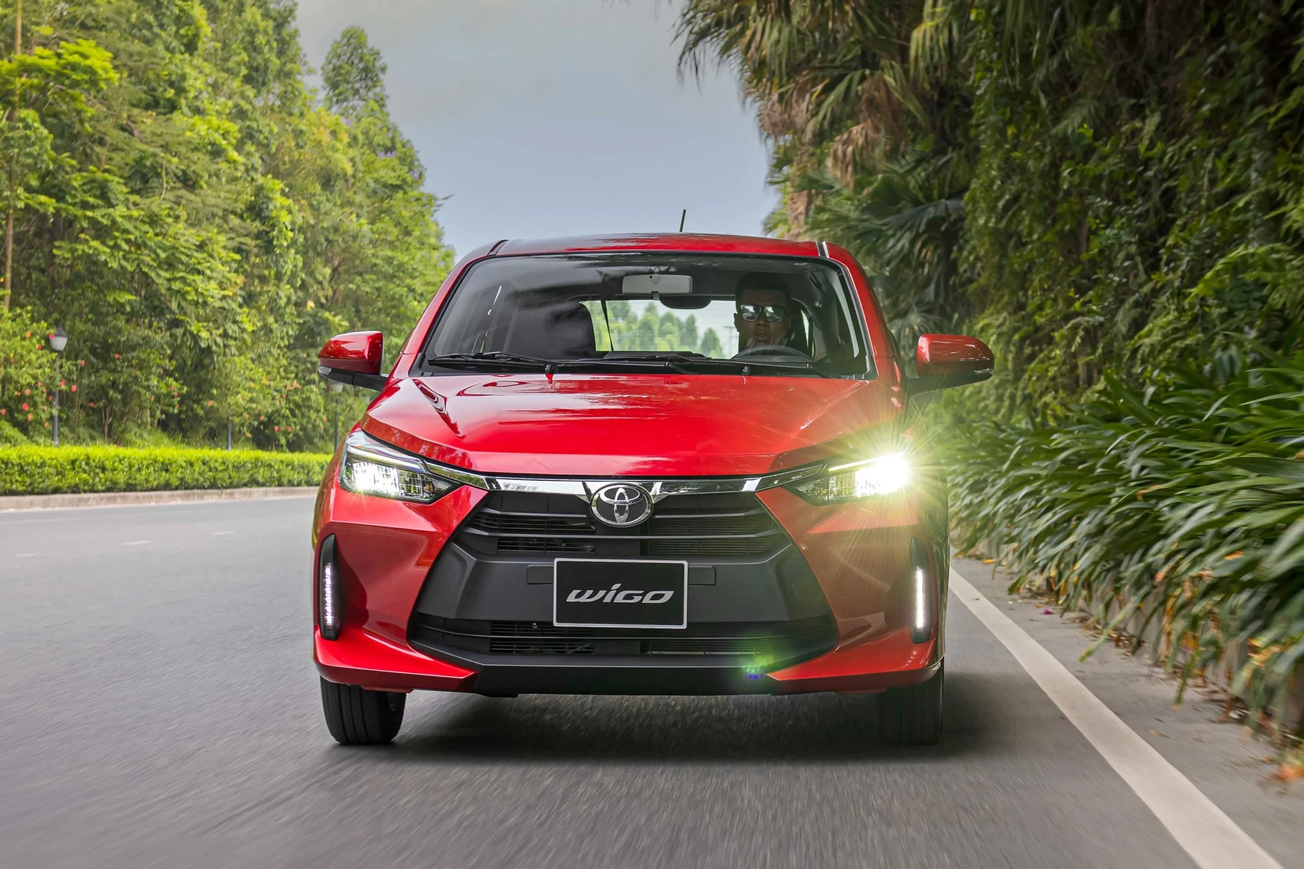 budget cars Vietnam, Vietnam EV market, Hyundai Grand i10, Toyota Wigo, Kia Morning, VinFast VF 3, affordable city cars, EV transition Vietnam 3