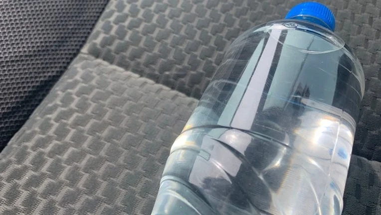 water bottle car heat, car interior fire risk, plastic bottle toxicity, hot car safety, car heat hazards, lithium battery fire, spray can explosion 2