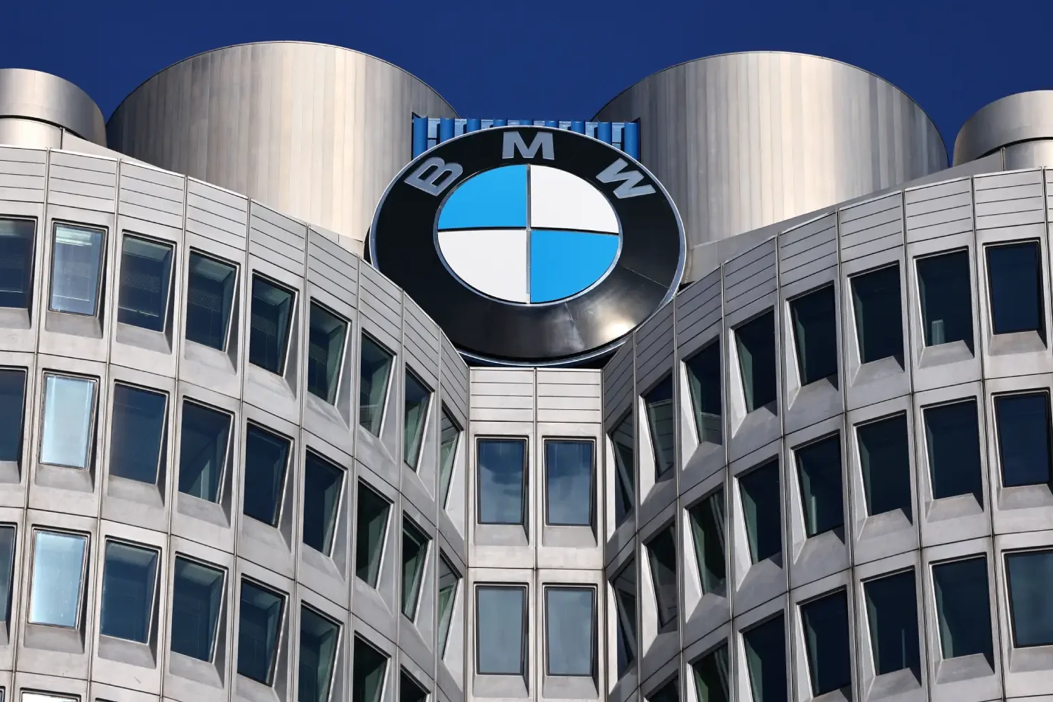 BMW profit warning, BMW cost cutting, BMW labor negotiations, automotive industry challenges, job cuts in Europe, BMW China market, car manufacturer restructuring 2