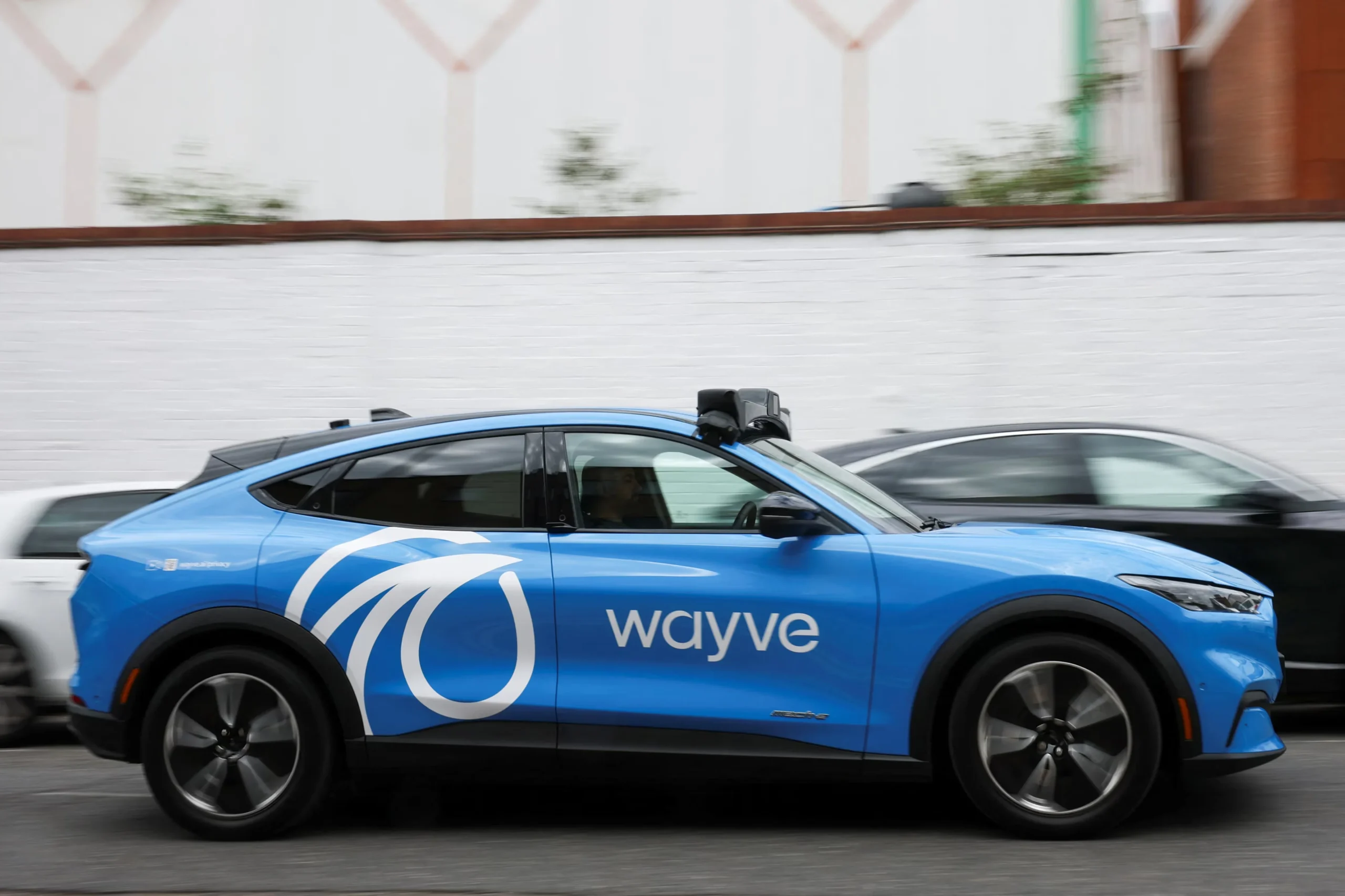 Uber robotaxi, London autonomous taxis, self-driving ride-hailing, Wayve AI, electric robotaxi, autonomous vehicles UK, Ford Mustang Mach-E 4