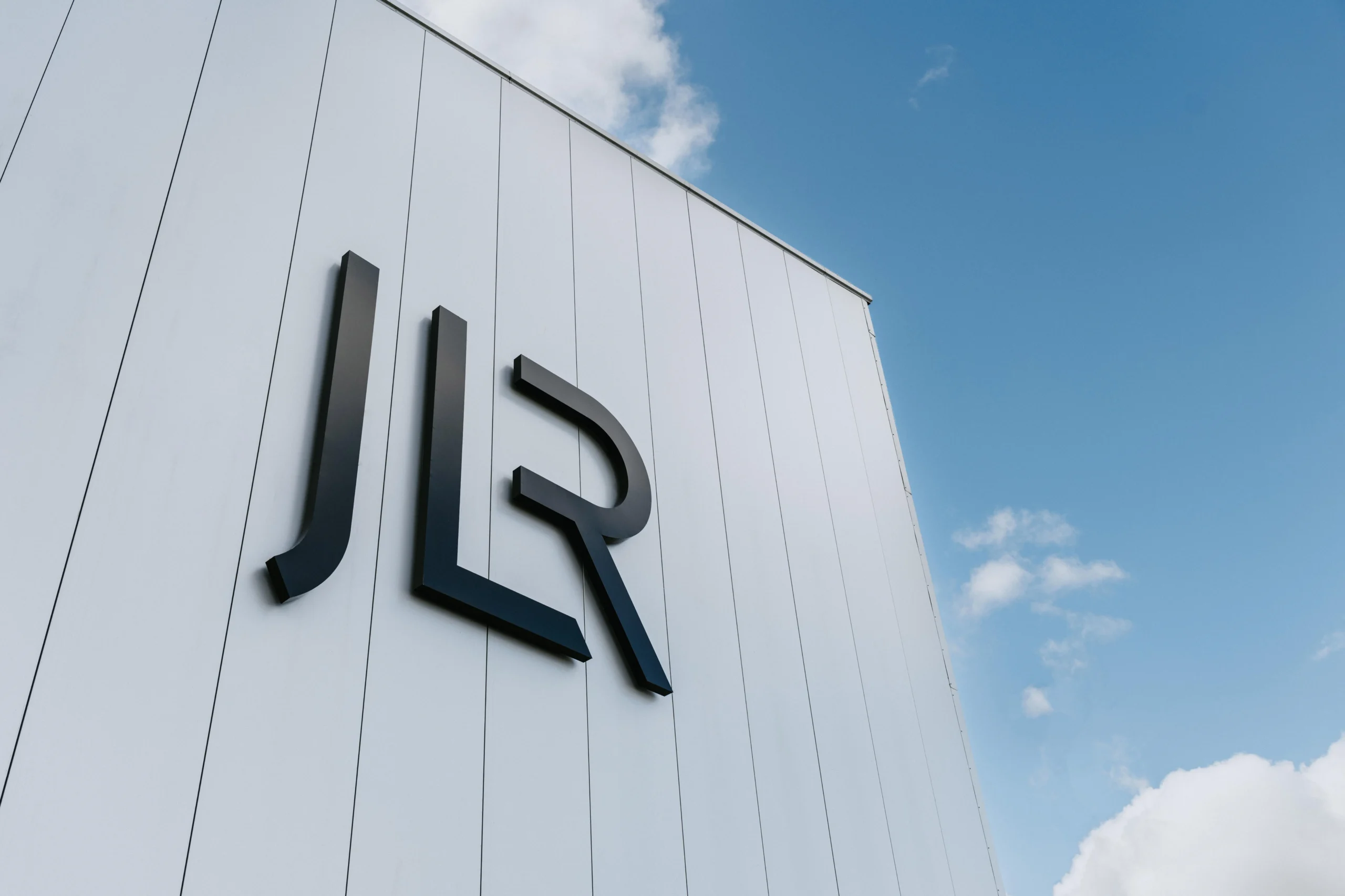 Jaguar Land Rover profit, Tata Motors stock, US market expansion, auto industry earnings, luxury car margins, electric vehicle strategy, Stellantis partnership 2
