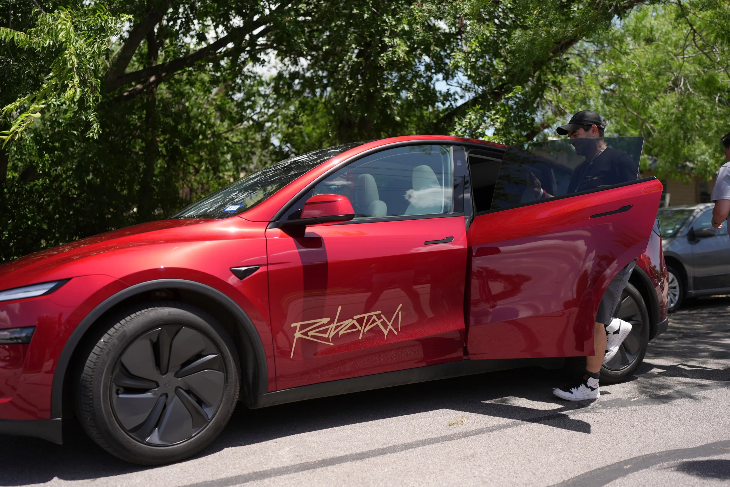 Tesla stock, J.P. Morgan rating, autonomous driving, AI, robotaxi, electric vehicles, Elon Musk, SpaceX IPO 3